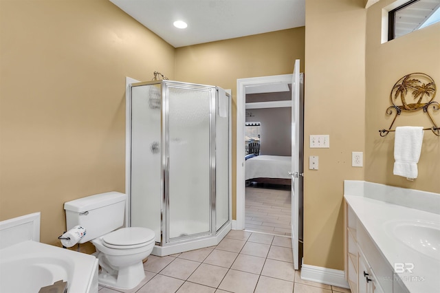 201 W 13th St Unit 2 B, Gulf Shores, AL 36542 - bathroom featuring a stall shower, tile patterned flooring, toilet, and vanity