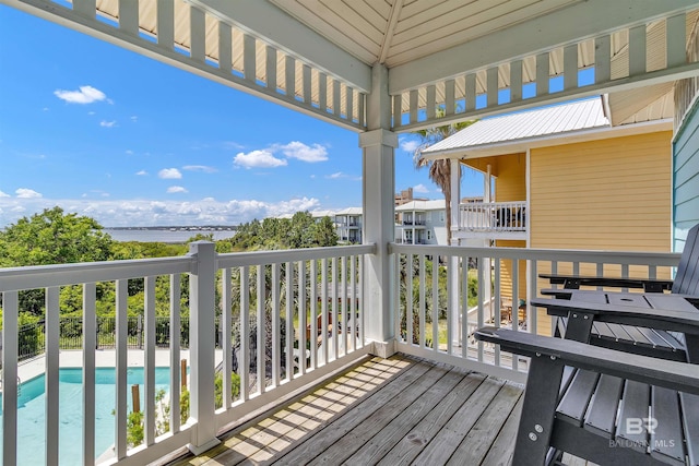 201 W 13th St Unit 2 B, Gulf Shores, AL 36542 - wooden deck featuring a water view