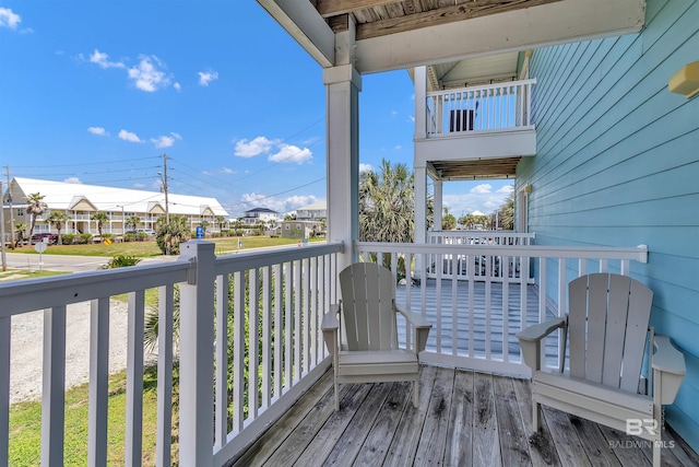 201 W 13th St Unit 2 B, Gulf Shores, AL 36542 - wooden terrace featuring a residential view