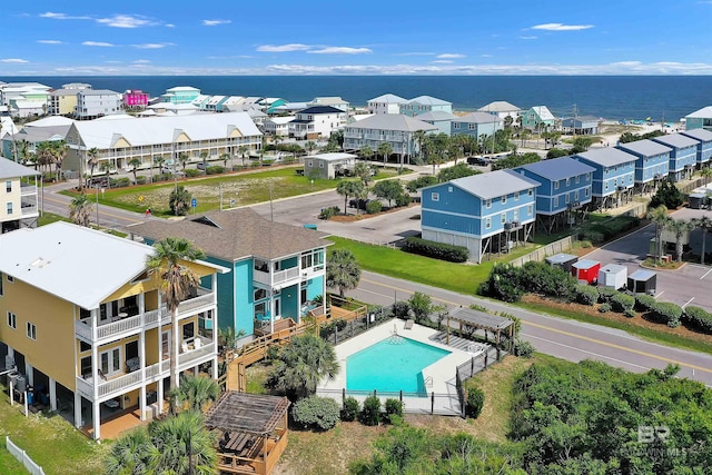 201 W 13th St Unit 2 B, Gulf Shores, AL 36542 - drone / aerial view of a pool area and a nearby body of water