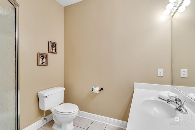 201 W 13th St Unit 2 B, Gulf Shores, AL 36542 - bathroom with toilet, tile patterned floors, baseboards, and vanity