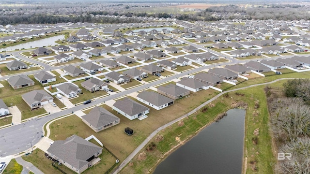 bird's eye view featuring a residential view and a water view