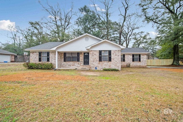 single story home with a front yard