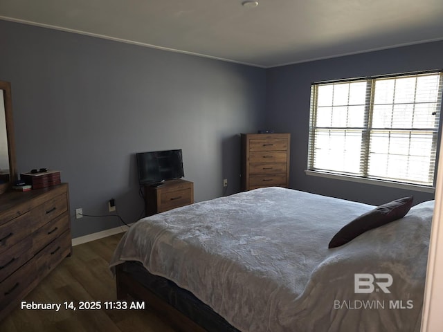 bedroom with dark wood-type flooring