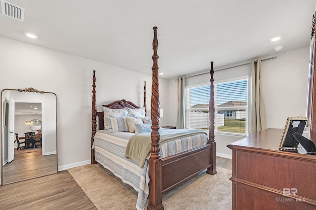 bedroom featuring light wood-style flooring, recessed lighting, and baseboards