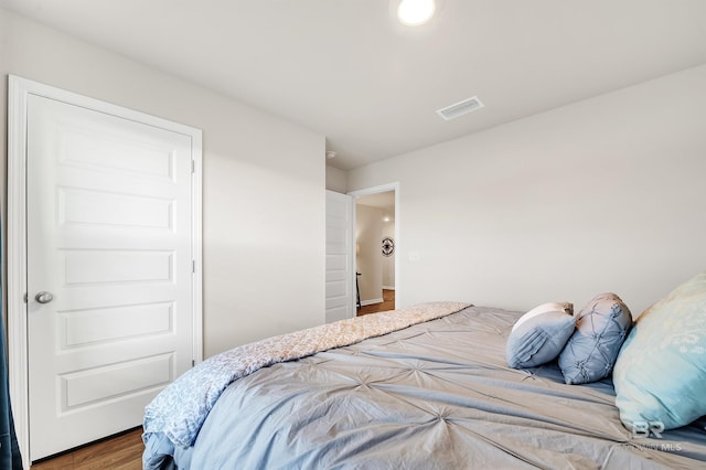 bedroom featuring wood finished floors