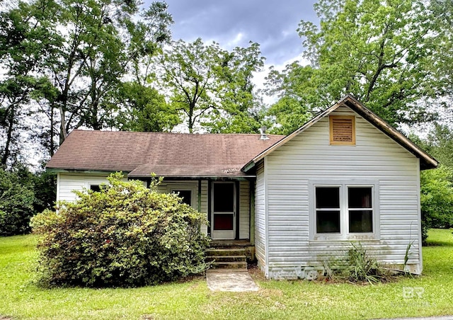 42186 Nicholsville Rd, Bay Minette, AL 36507 - view of front of house featuring a front lawn and a shingled roof