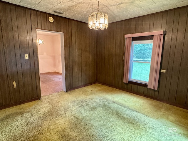 42186 Nicholsville Rd, Bay Minette, AL 36507 - carpeted spare room with a chandelier, wood walls, and a smoke detector