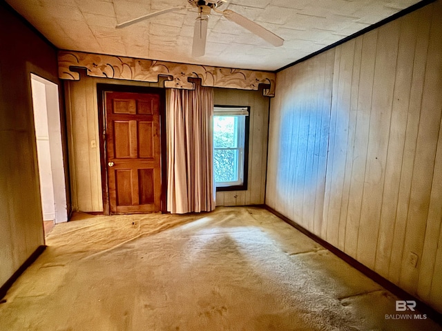 42186 Nicholsville Rd, Bay Minette, AL 36507 - spare room with carpet, ceiling fan, and wooden walls