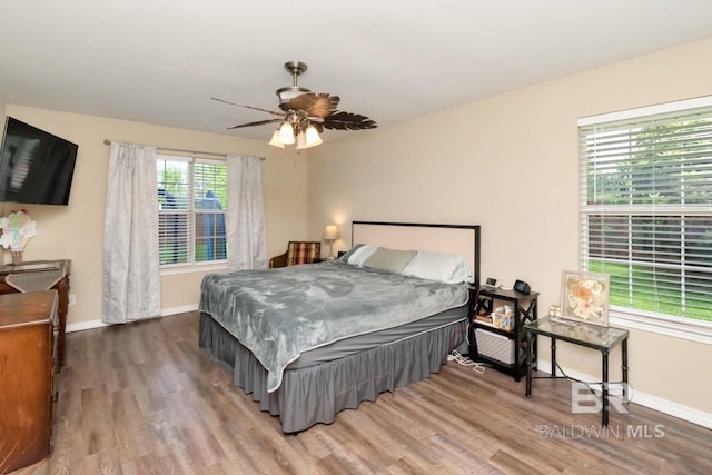 10234 Scott Plantation Dr, Mobile, AL 36695 - bedroom with wood finished floors and a ceiling fan