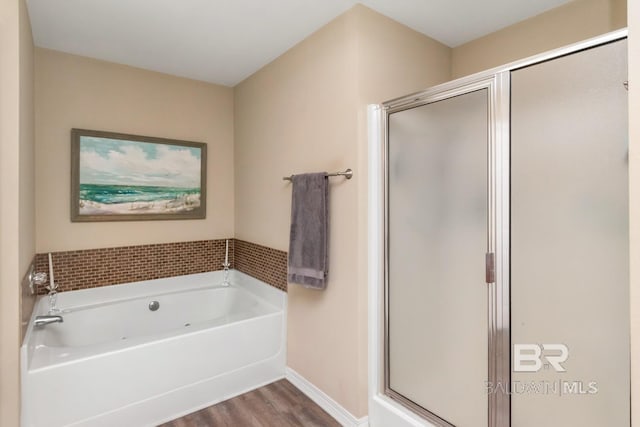 10234 Scott Plantation Dr, Mobile, AL 36695 - bathroom featuring wood finished floors, a bath, and a shower stall