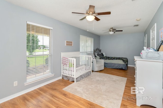 10234 Scott Plantation Dr, Mobile, AL 36695 - bedroom featuring wood finished floors and a ceiling fan