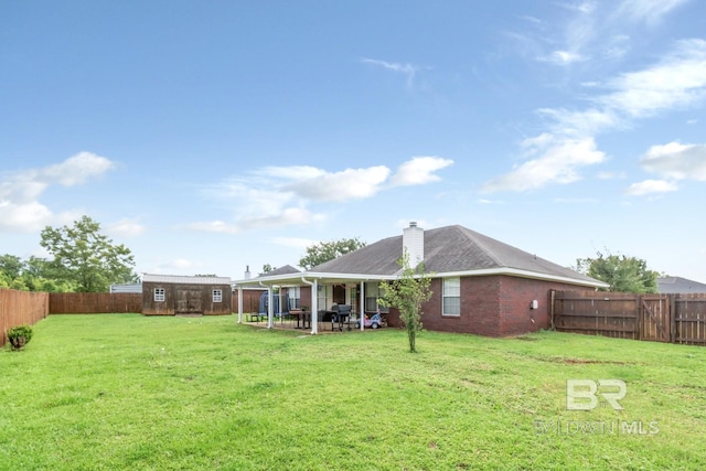 10234 Scott Plantation Dr, Mobile, AL 36695 - fenced backyard featuring a patio area and a storage unit