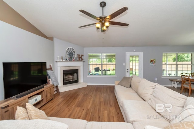 10234 Scott Plantation Dr, Mobile, AL 36695 - living room featuring vaulted ceiling, wood finished floors, ceiling fan, plenty of natural light, and a fireplace