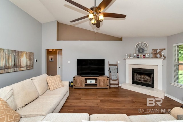 10234 Scott Plantation Dr, Mobile, AL 36695 - living area with a ceiling fan, wood finished floors, a fireplace with raised hearth, and vaulted ceiling