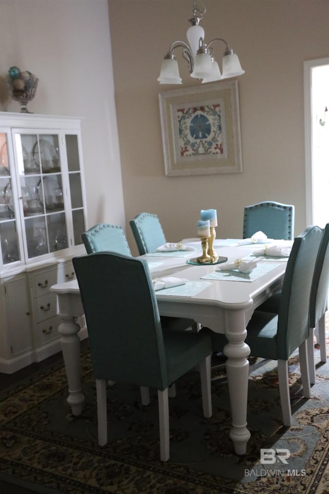 dining space featuring an inviting chandelier