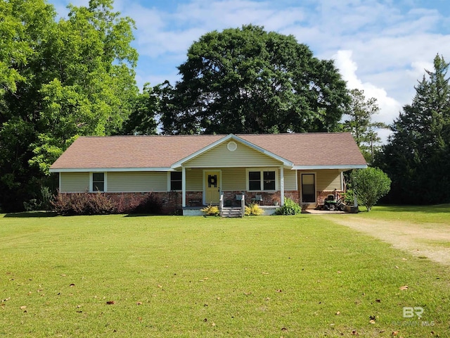 571 Georgia Ln, Brewton, AL 36426 - view of front of home featuring covered porch, a front lawn, and driveway