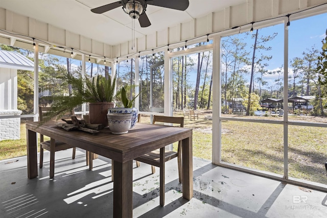 sunroom / solarium featuring ceiling fan