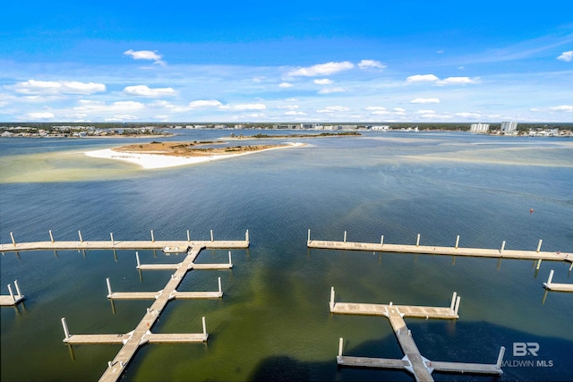 birds eye view of property featuring a beach view and a water view