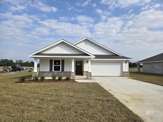 craftsman-style home with driveway, brick siding, an attached garage, and a front yard