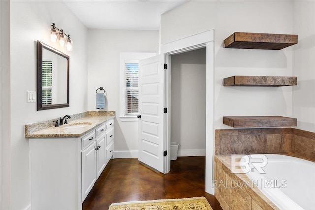 bathroom with a relaxing tiled tub, a healthy amount of sunlight, vanity, and concrete floors