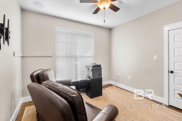 sitting room featuring hardwood / wood-style flooring and ceiling fan