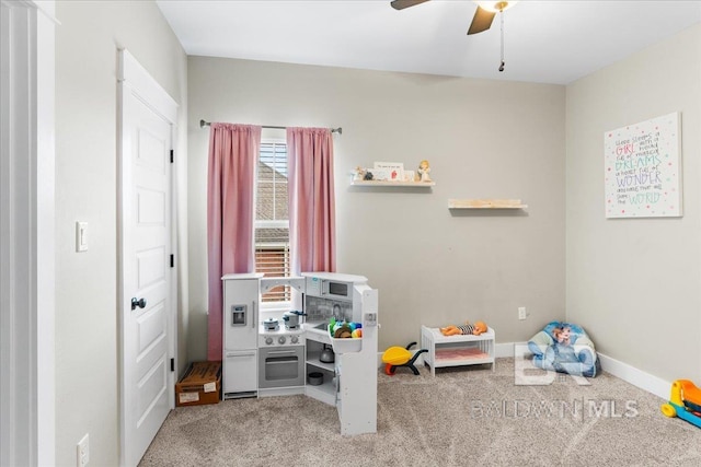 recreation room featuring carpet and ceiling fan