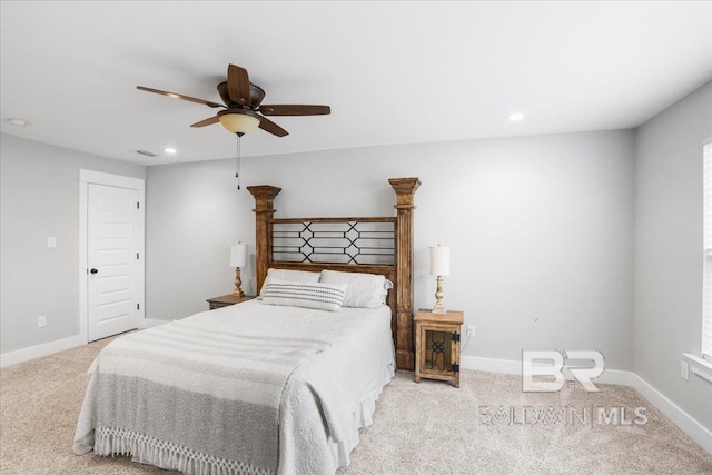 bedroom featuring light carpet and ceiling fan