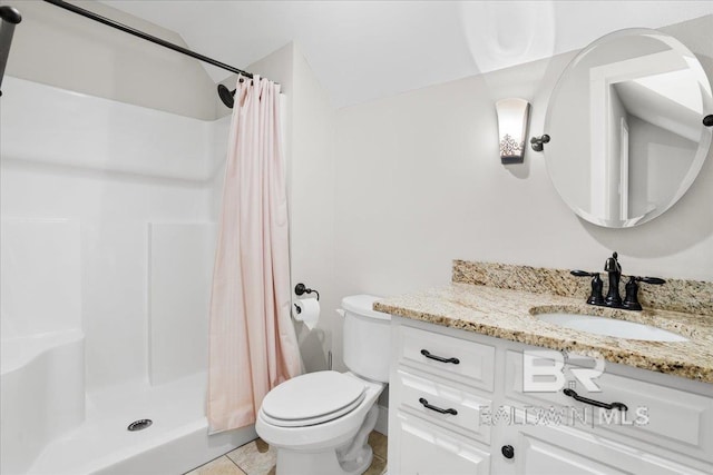 bathroom with tile patterned floors, vanity, toilet, and a shower with shower curtain