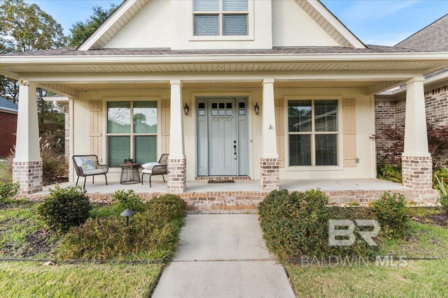 property entrance with covered porch