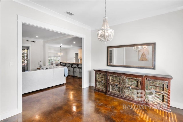 interior space with crown molding and a chandelier