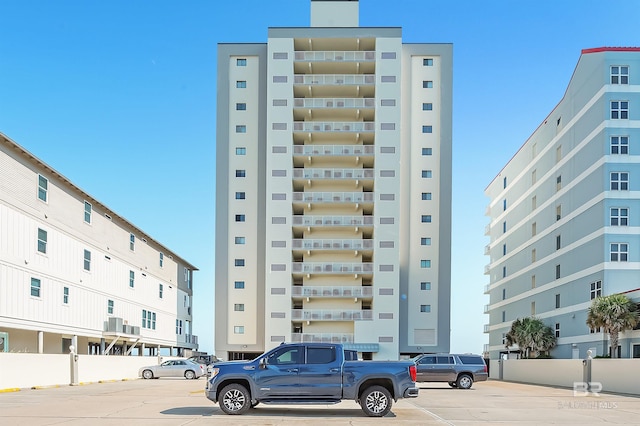 view of property featuring uncovered parking