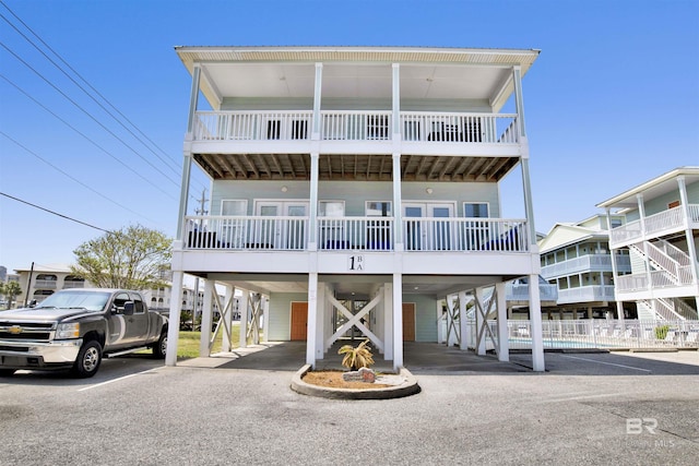 coastal inspired home featuring a carport