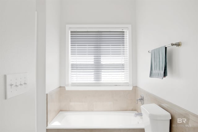 full bathroom with a bath