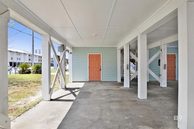 view of patio with a carport and stairs