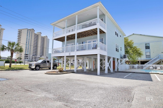 exterior space featuring a carport and uncovered parking