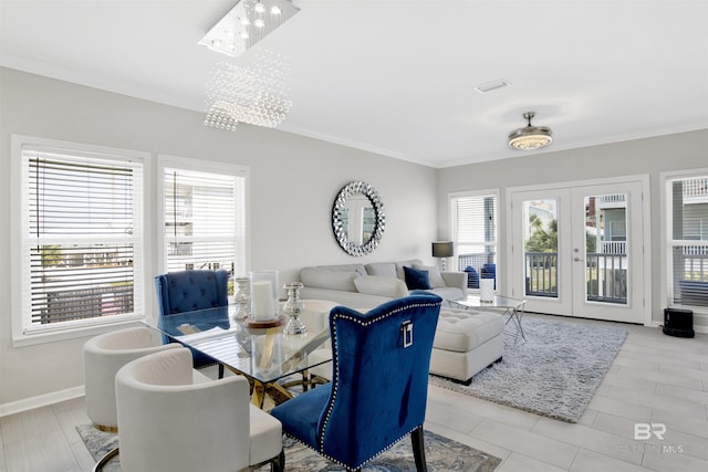 dining area with baseboards, ornamental molding, french doors, and light tile patterned floors