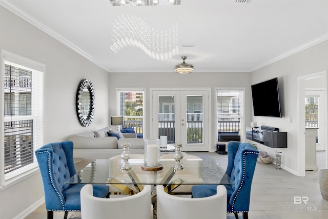 dining area with french doors, crown molding, a healthy amount of sunlight, and baseboards