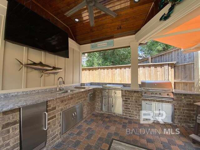 view of patio with a ceiling fan and exterior kitchen
