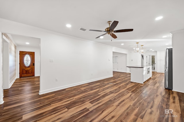 unfurnished living room featuring ornamental molding, recessed lighting, and dark wood-style floors