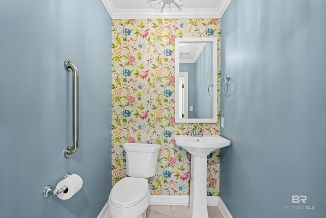 half bathroom with baseboards, ornamental molding, toilet, and wallpapered walls