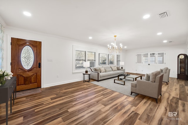 living room featuring visible vents, dark wood finished floors, crown molding, and recessed lighting