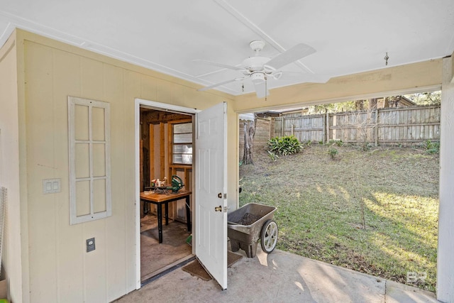 view of yard with ceiling fan, fence, and a patio