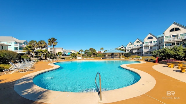 view of swimming pool featuring a gazebo and a patio area