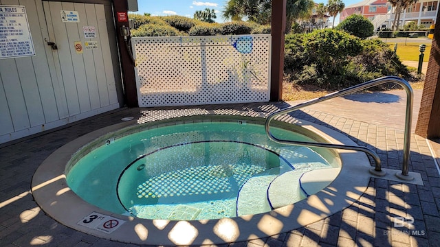 view of pool featuring a community hot tub