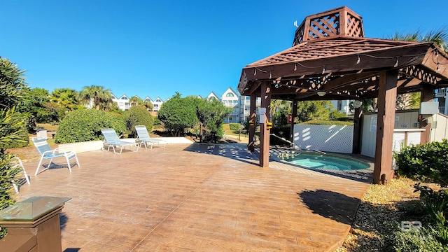 view of patio featuring a gazebo and a pool