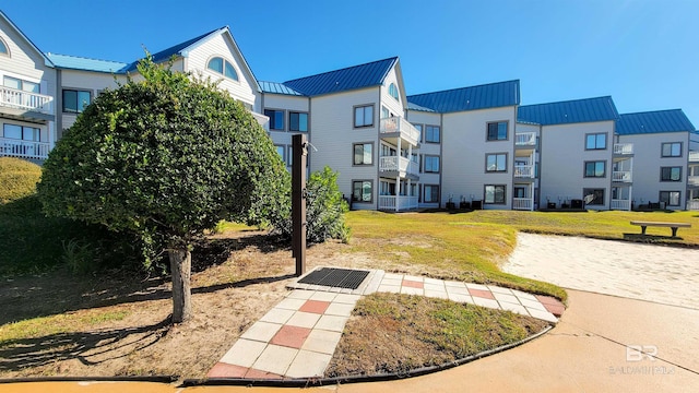 view of community featuring a lawn