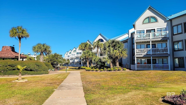 view of home's community featuring a lawn