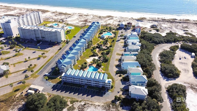 drone / aerial view featuring a view of the beach and a water view