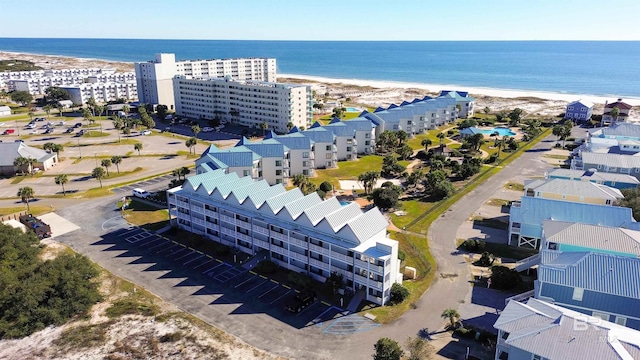 bird's eye view featuring a water view and a view of the beach